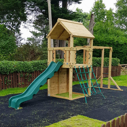 Goodrich Tower with slide, climbing wall, net and monkey bars. INSTALLED