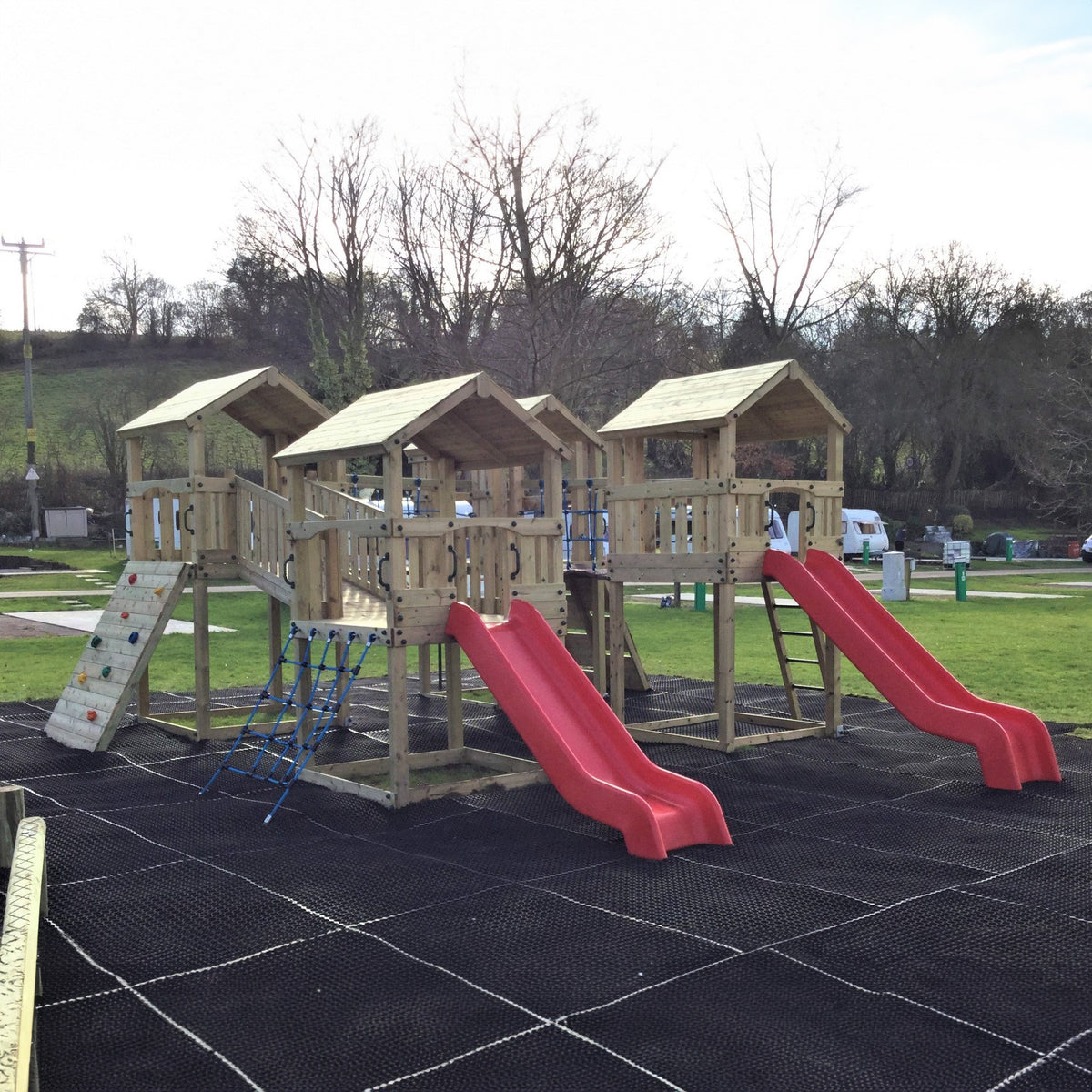 Ludlow Commercial Climbing frame with towers, slides, climbing wall, climber, fireman’s pole and bridges. With installation
