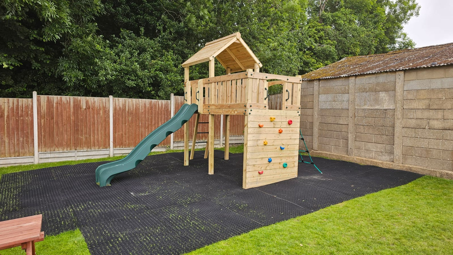 Eastnor Play Tower with ladder, climbing wall, net, and slide. INSTALLED