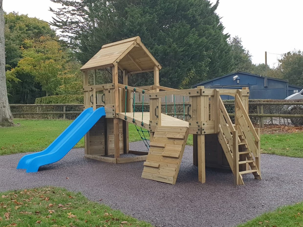 Croft Towers with slide, ladder, climbing walls, net, left-right climber and bridge. INSTALLED
