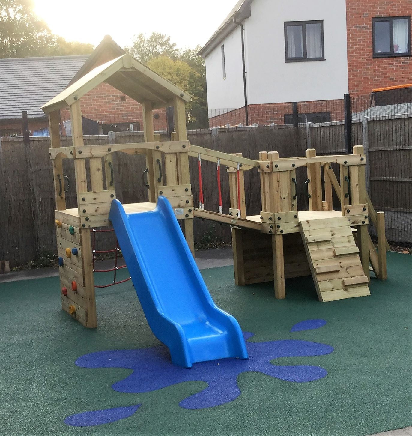 Croft Towers with slide, ladder, climbing walls, net, left-right climber and bridge. INSTALLED