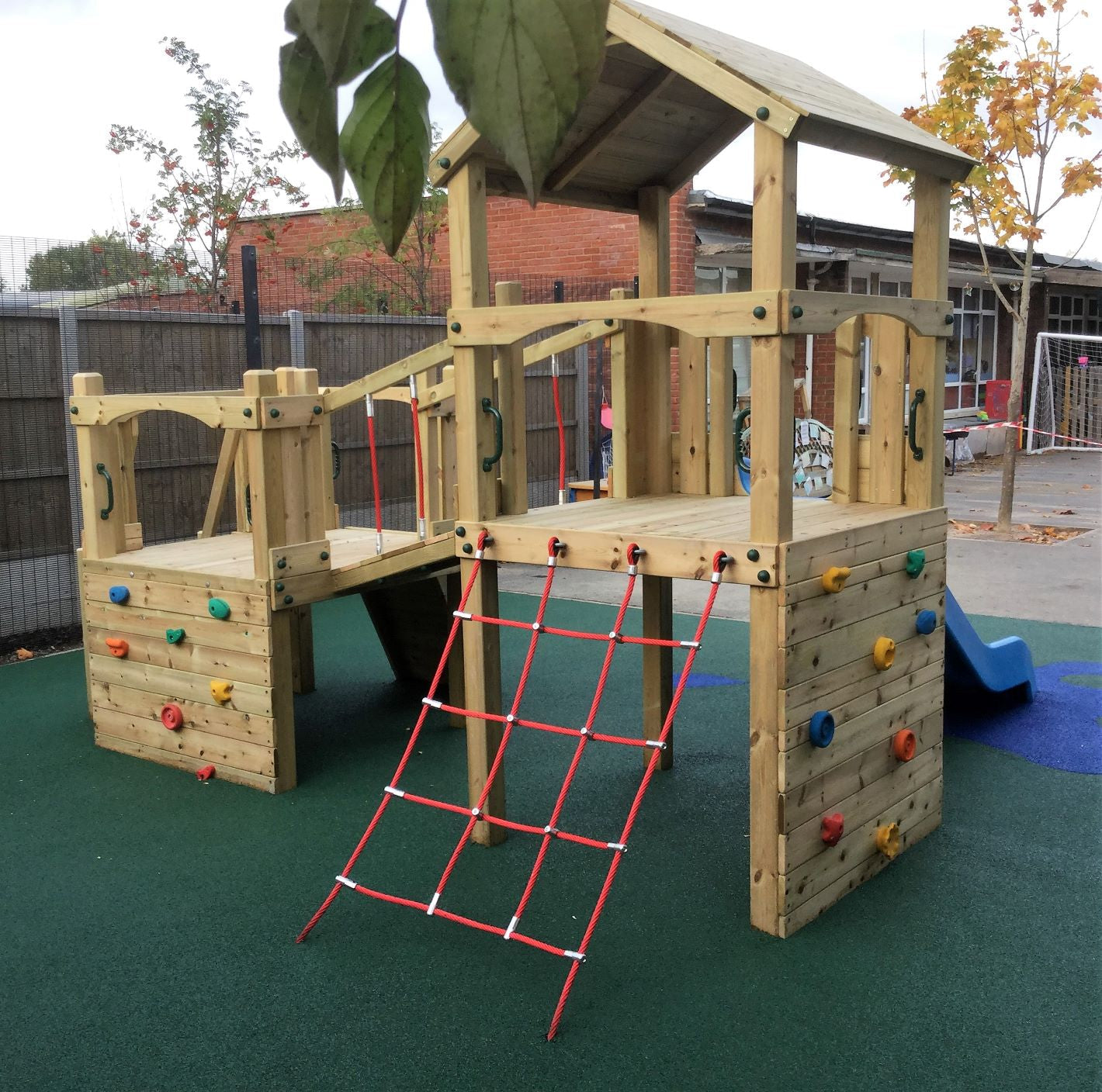 Croft Towers with slide, ladder, climbing walls, net, left-right climber and bridge. INSTALLED