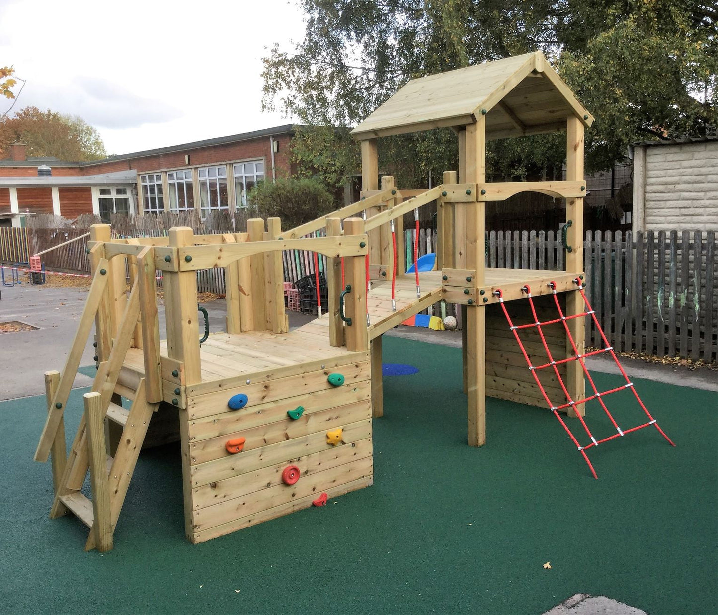 Croft Towers with slide, ladder, climbing walls, net, left-right climber and bridge. INSTALLED