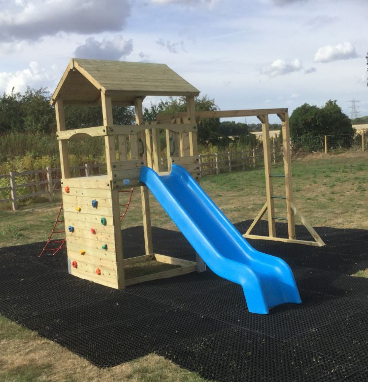 Goodrich Tower with slide, climbing wall, net and monkey bars. INSTALLED