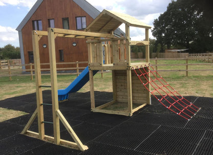 Goodrich Tower with slide, climbing wall, net and monkey bars. INSTALLED