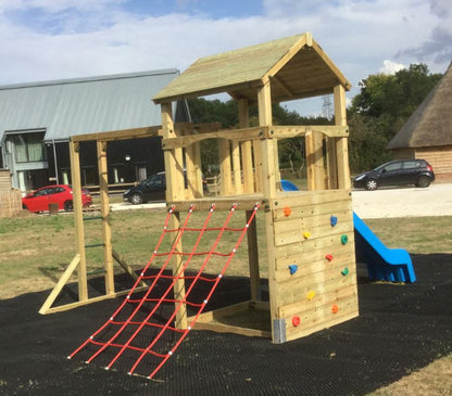 Goodrich Tower with slide, climbing wall, net and monkey bars. INSTALLED