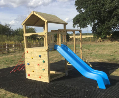 Goodrich Tower with slide, climbing wall, net and monkey bars. INSTALLED
