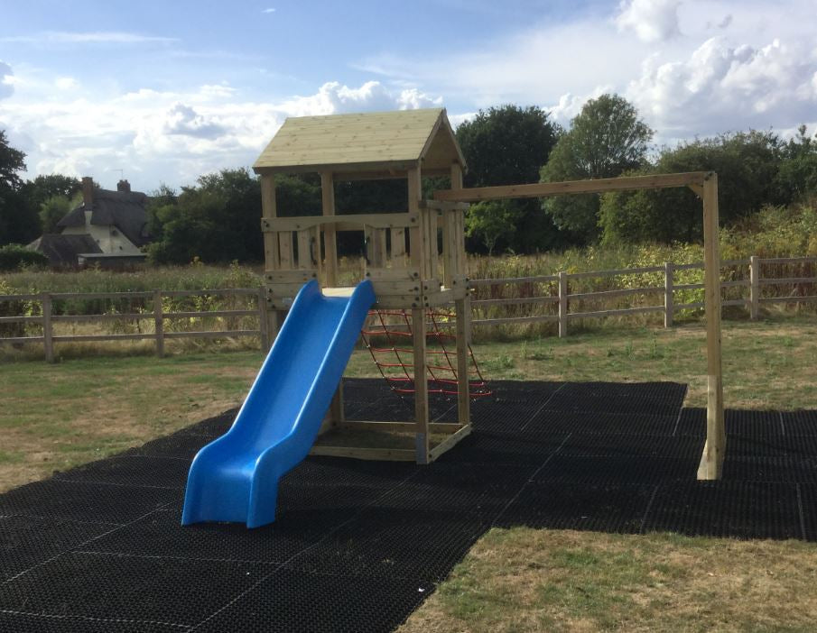 Goodrich Tower with slide, climbing wall, net and monkey bars. INSTALLED