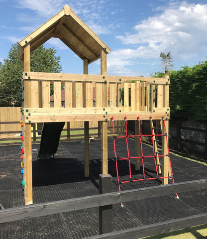 Eastnor Play Tower with ladder, climbing wall, net, and slide. INSTALLED
