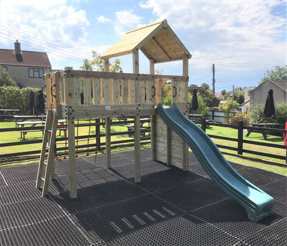 Eastnor Play Tower with ladder, climbing wall, net, and slide. INSTALLED