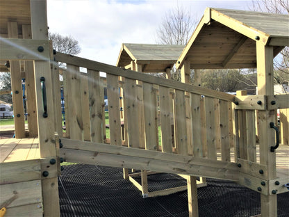 Ludlow Commercial Climbing frame with towers, slides, climbing wall, climber, fireman’s pole and bridges. With installation
